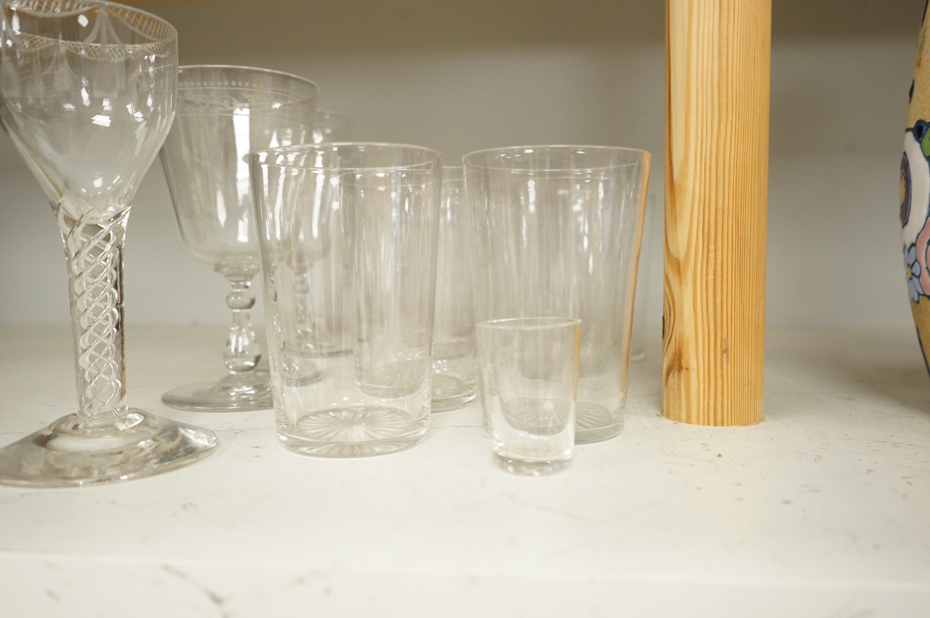 A pair of engraved glass goblets, seven tumblers engraved with the initial G and an air twist stem wine glass, etc. (12)